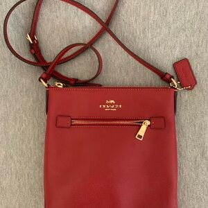 Coach Red Leather Crossbody Bag with Gold Accents.